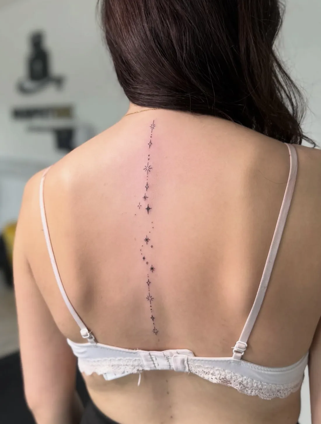 Line of small stars and sparkles running down the spine